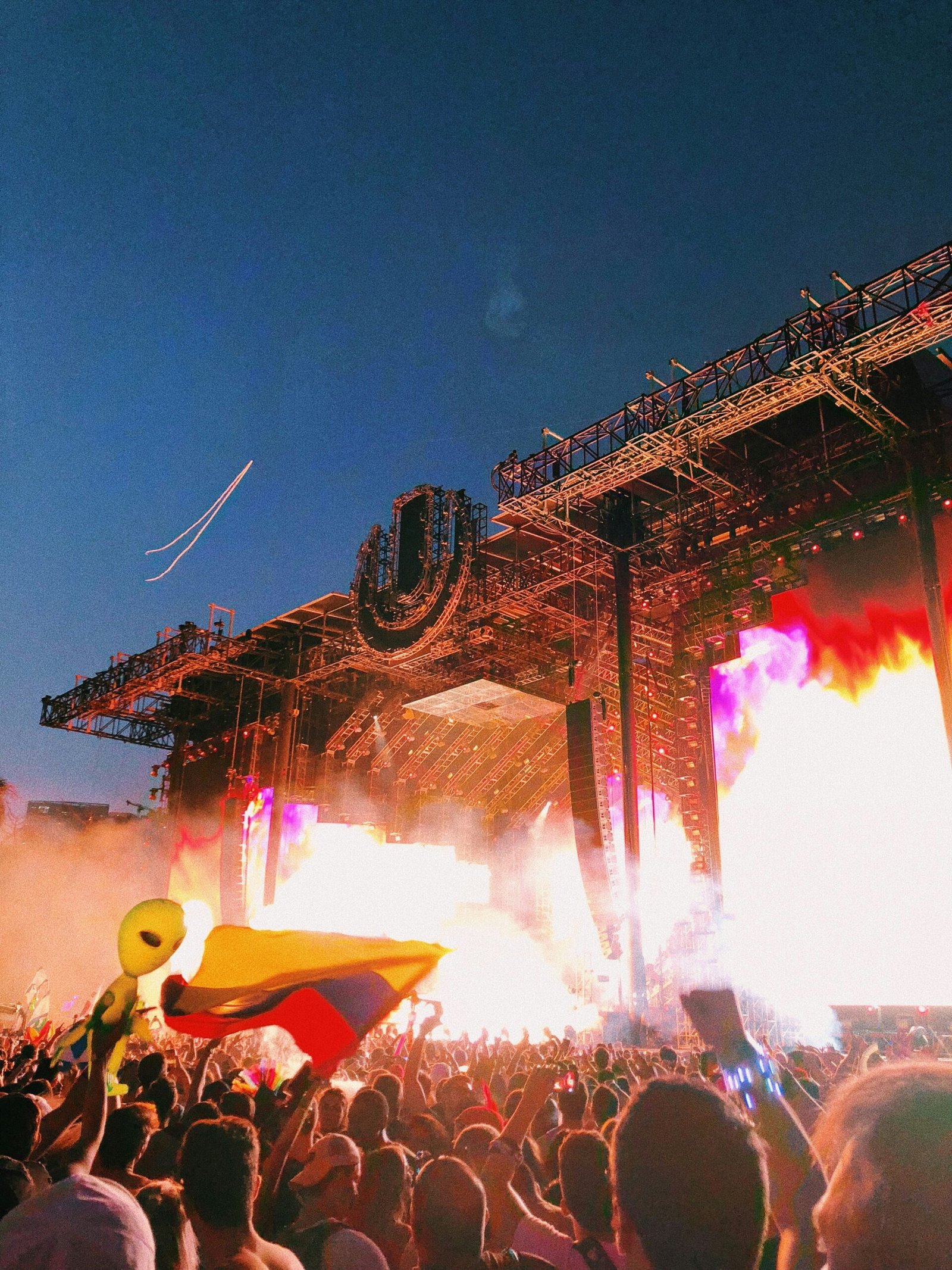 people watching fire bursting on stage
